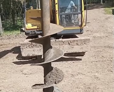 a construction worker is working on a pile of rocks