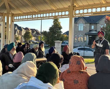 A Peel Police officer educating seniors on fraud prevention and personal safety during an event