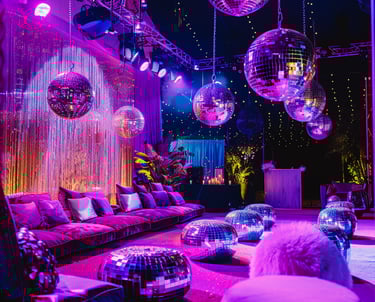 a room with a couch and disco ball decorations