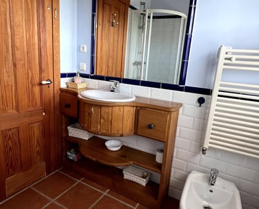 a rustic bathroom with a toilet and a sink
