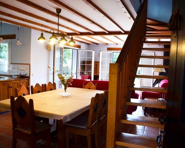 a dining room table with a table and chairs