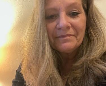 Wendy Stanfill CEO a woman with blonde hair and a black shirt