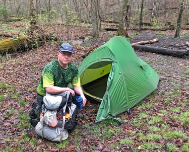 The author with his backpack and tent