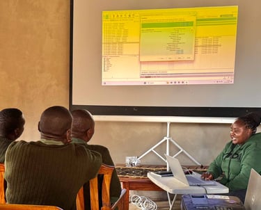 Researchers in classroom looking at presentation