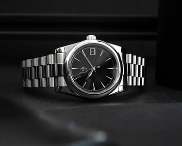 a watch with a metal bracelet