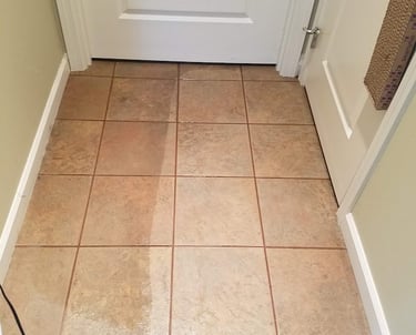 Professional tile and grout cleaning service showing a before and after floor cleaning