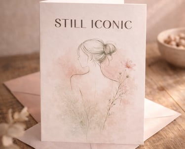 Elegant Still Iconic greeting card with a minimalist line art illustration of a woman and pink flowers.