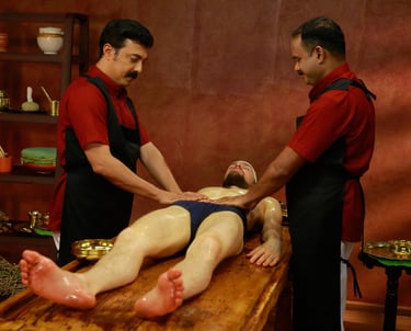 Qualified Ayurvedic practitioners performing abhyangam