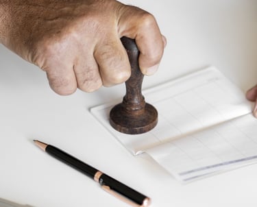 man using rubber stamp 