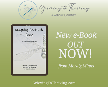 a tablet with the eBook Navigating Grief With Grace