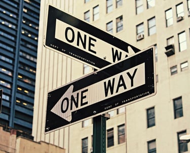 a one way street sign with a one way sign