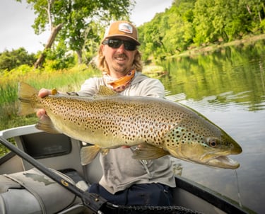 Guide John Stunkard with a South Holston River brown trout.