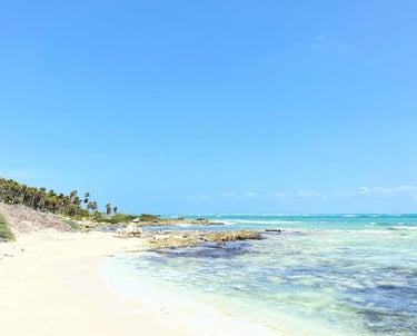 white  sandy beach providing a peaceful space to enjoy nature during yoga and meditation retreats for women