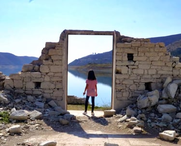 Young traveller exploring stone ruins in Alassa village