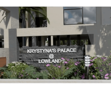 Building sign reading "KRYSTYNA'S PALACE @ Lowlands" at entrance of commercial property real-estate