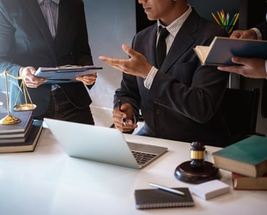a man in a suit and tie is holding a tablet computer