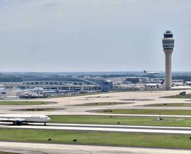 a plane taking off from a runway at an airport