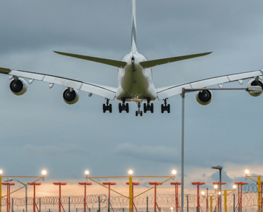 a large jetliner landing at an airport