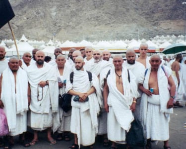 a group of men performing Hajj