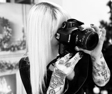 a woman taking a photo at Factory of you