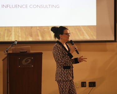 Jennie Fowler delivering a keynote at a PMI event on PMO leadership and strategic project delivery