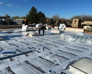 men installing a building roof