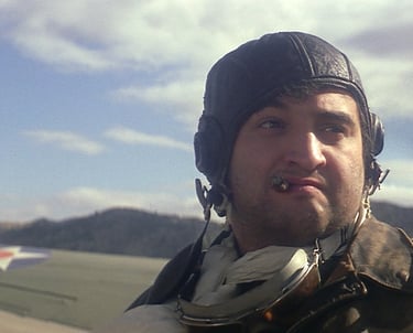 a man in a leather jacket and a helmet