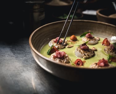 a bowl of food with chopsticks and chopsticks