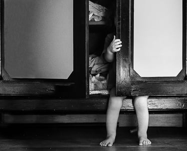 a child's feet are shown in a black and white photo