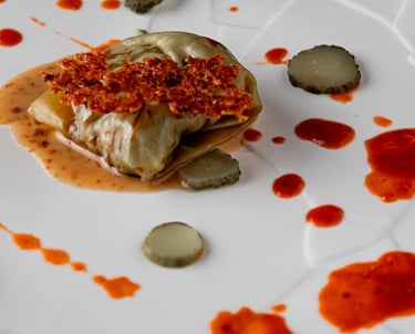 a plate with a small piece of food on it