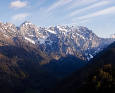 a mountain scene with a view of a valley
