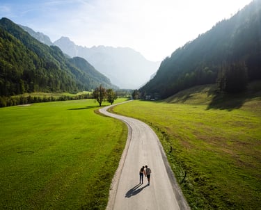 a person riding a bike down a road