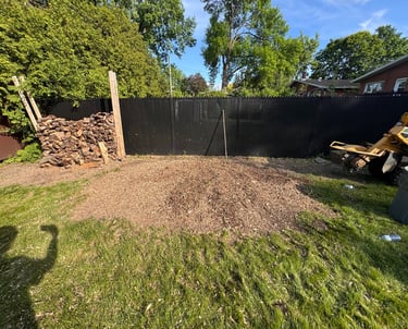 Stump removal in progress on a residential lawn in Saint-Lazare, restoring yard safety and appearanc
