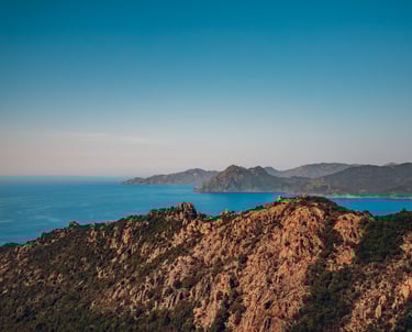 a mountain view of a mountain range with a blue sky