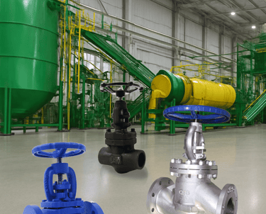 a group of three valves and valves in a warehouse