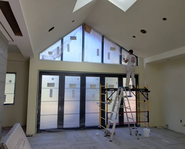 House painter a man standing on a scaffolding with a ladder - Full Interior House Painting
