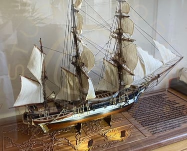 Display base for a model ship display showing integrated lighting