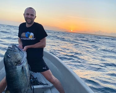 A collage of fish species found in Zanzibar, including marlin, giant trevally, tuna, and sailfish.