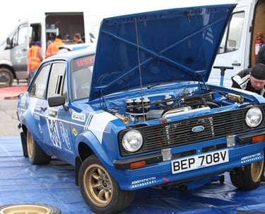 An Escort rally car improving the car set-up for a race.