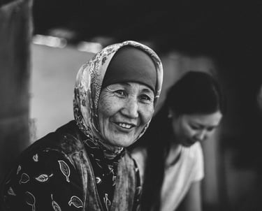 a woman with a headscarf smiling