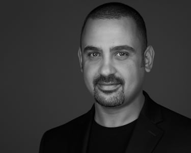 black and white headshot photo of hamza rouissi