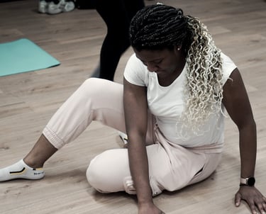 a woman about to get up from the floor in a Feldenkrais lesson