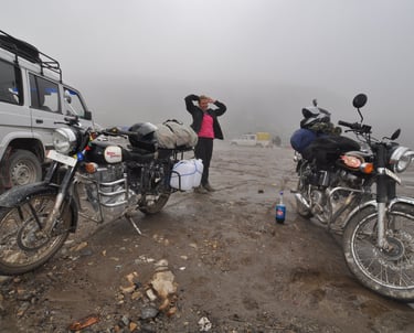 Tracey Billington riding the Leh to Manali highway over the great Himalayan range, Ladakh, India 