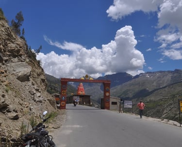 Tracey Billington riding the Leh to Manali highway over the great Himalayan range, Ladakh, India 