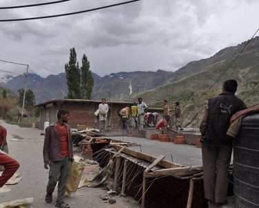 Tracey Billington riding the Leh to Manali highway over the great Himalayan range, Ladakh, India 