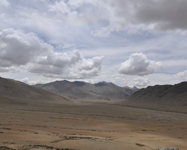 Tracey Billington riding the Leh to Manali highway over the great Himalayan range, Ladakh, India 