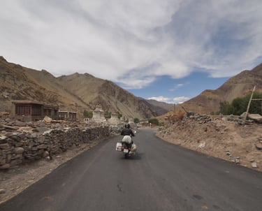 Tracey Billington riding the Leh to Manali highway over the great Himalayan range, Ladakh, India 