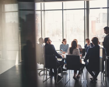 a group of people sitting around a table