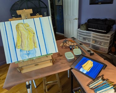 Art Studio setup with table top easel, iPad, brushes, paints and mixing tubs.