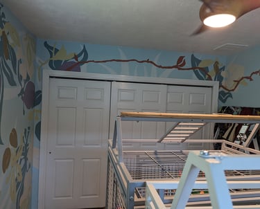 Using bright contrasting color shapes for a bright stylist interior wall mural with closet doors.